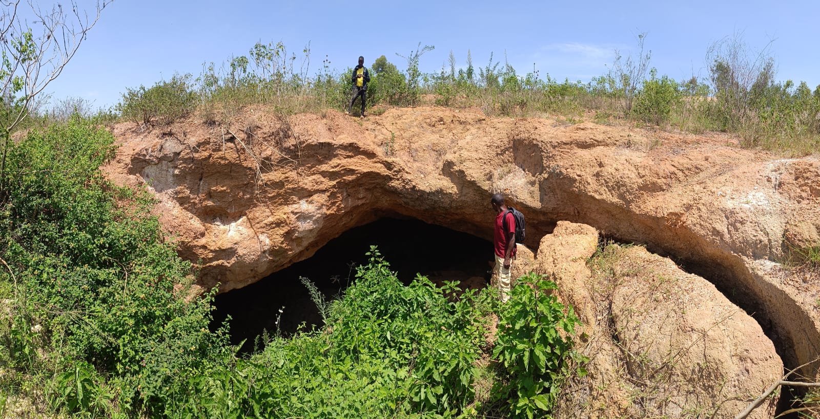 Old shaft showing weathered pegmatite