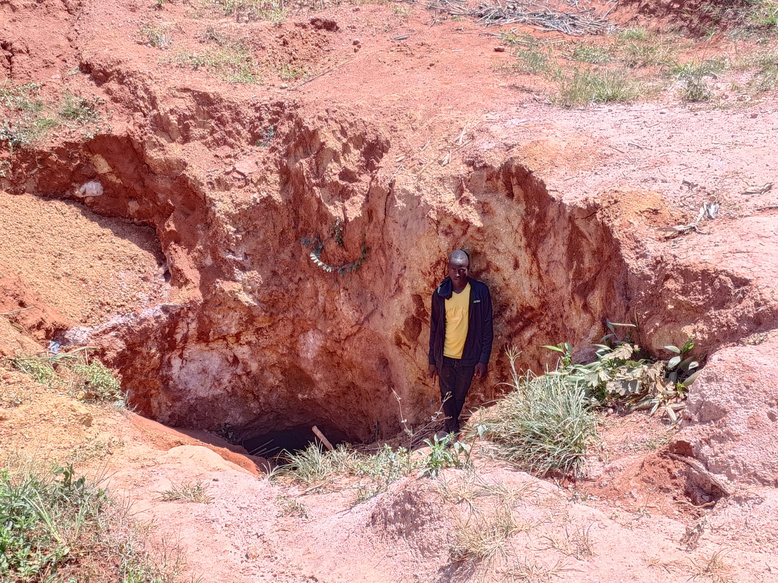 Artisanal workings on weathered pegmatite